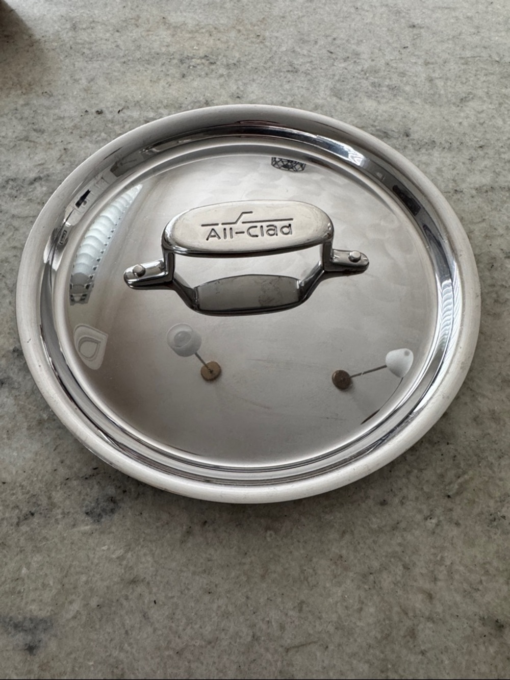 All-Clad Stainless Steel Cookware Lid - Polished Silver 9” diameter.